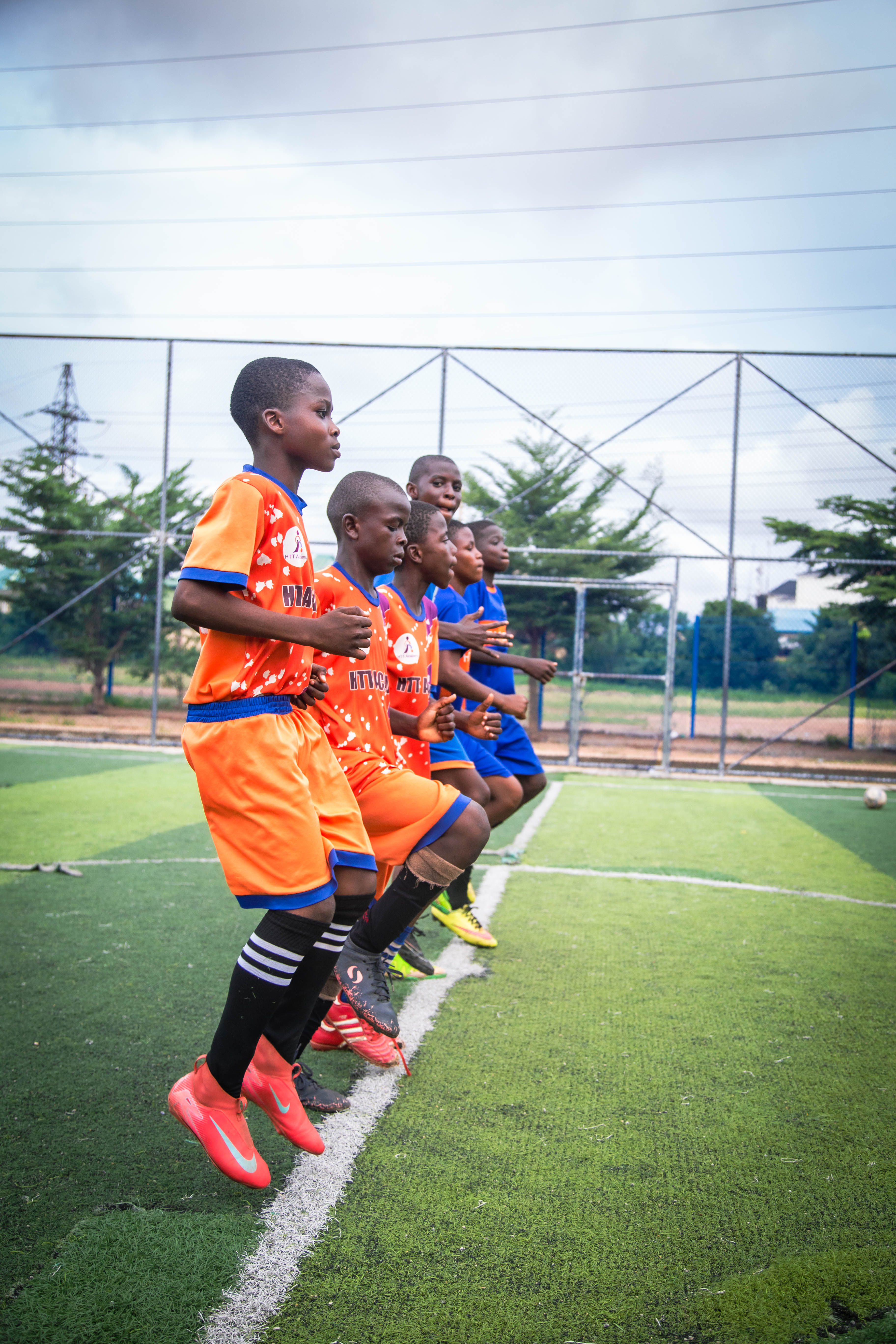 HTT Academy players running in formation during training